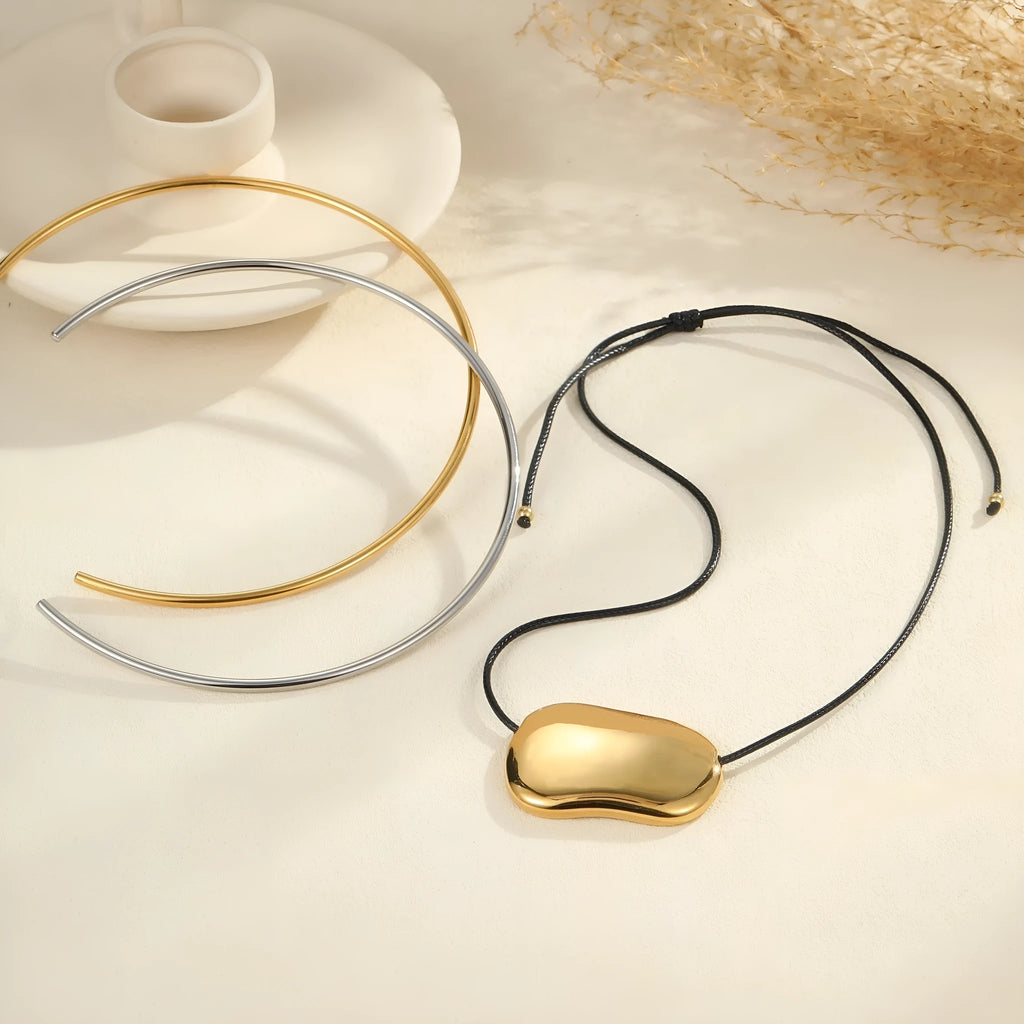 Stainless steel necklace with geometric pendant in gold or silver finish on adjustable 41-50cm chain
