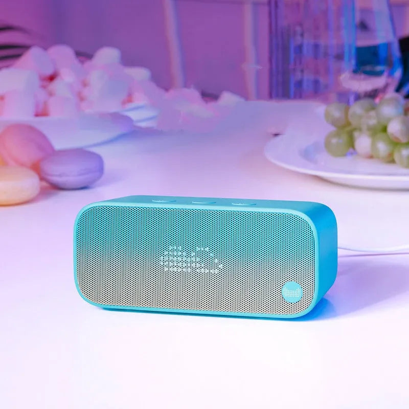 Compact smart Wi-Fi speaker with AI voice assistant in a choice of blue, green, red, or white colours.