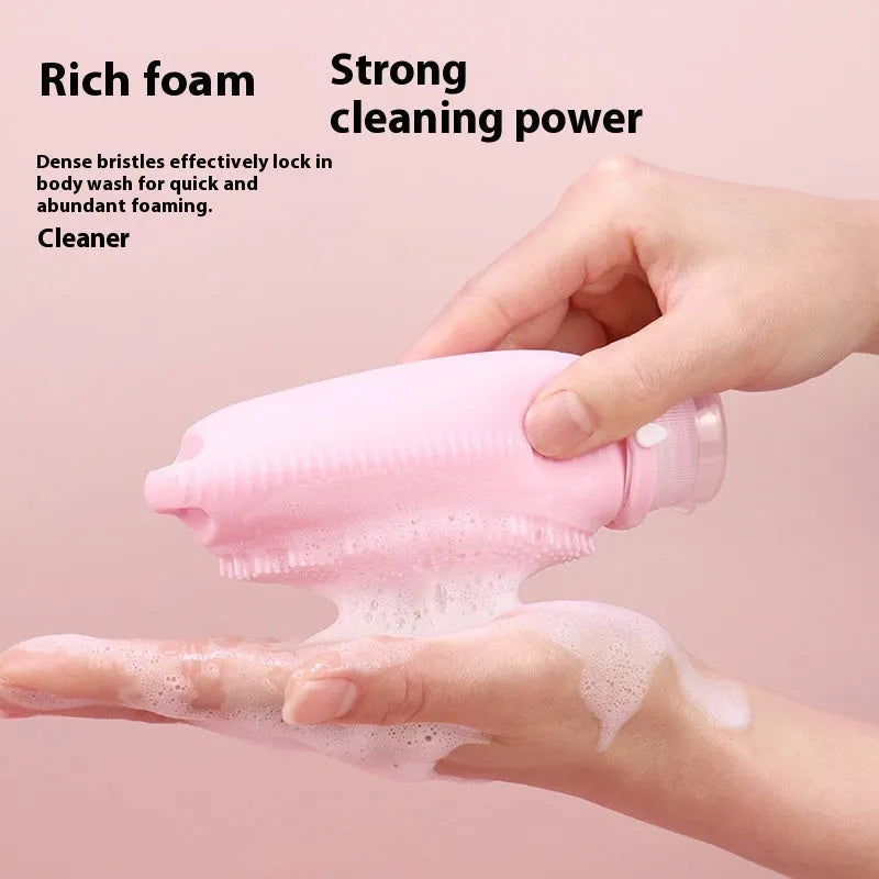 Silicone bath brush storage bottle in a choice of colours including pink and sea blue on a bathroom counter.