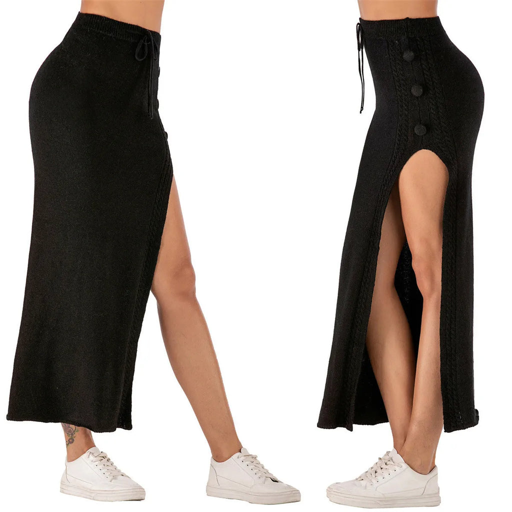 Women's black slim-fit acrylic midi skirt with a side split and strappy detail on a hanger.