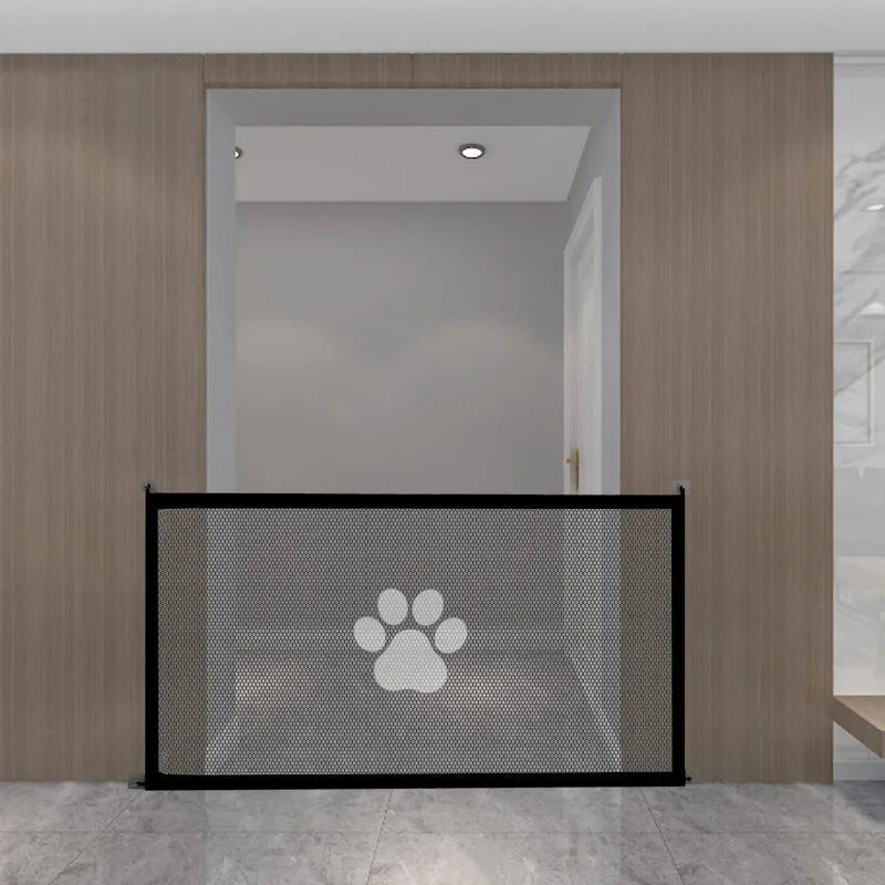 Folding cloth dog barrier net with pet doorsill showing black dog footprint design, shown in a doorway.