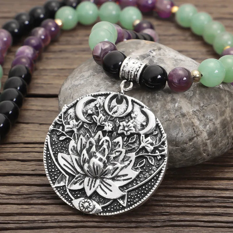 Geometric lotus pendant yoga necklace with stone bead chain and matching bracelet on white background