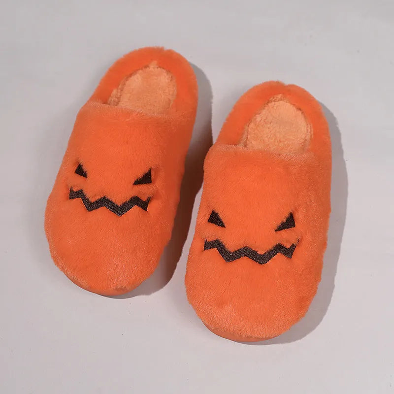 Orange Halloween pumpkin-themed plush slippers with a coral velvet upper and non-slip sole.
