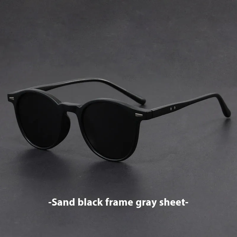 Retro round oval frame sunglasses with polarised grey lenses shown in multiple colour options.