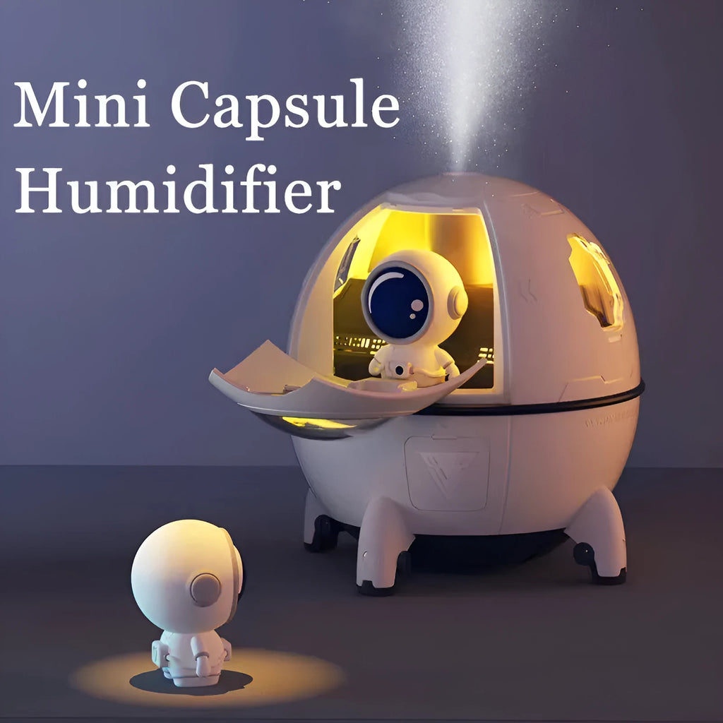 Purple astronaut-shaped USB desktop humidifier with LED lights on a desk