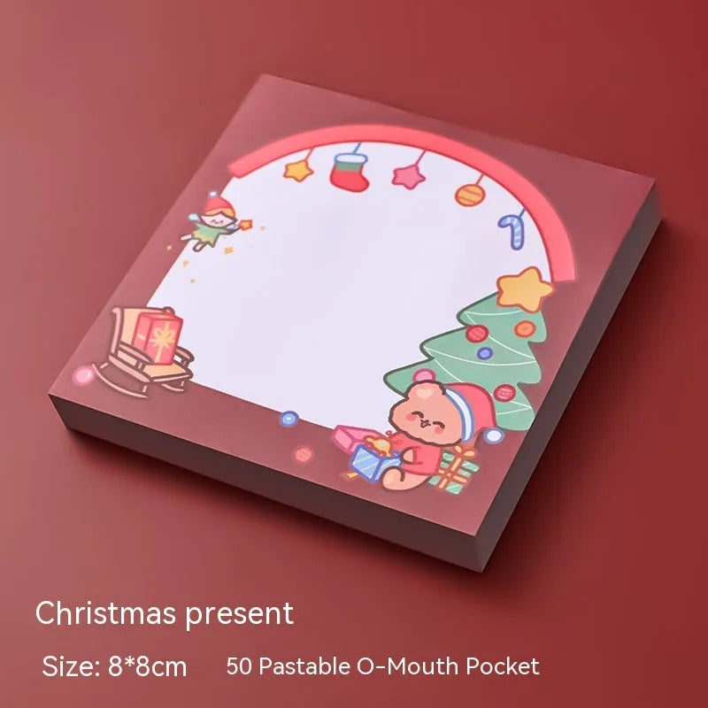 Christmas sticky notes book with cartoon designs of Santa, snowman, elf, gift, house, sled, crystal ball, and bear