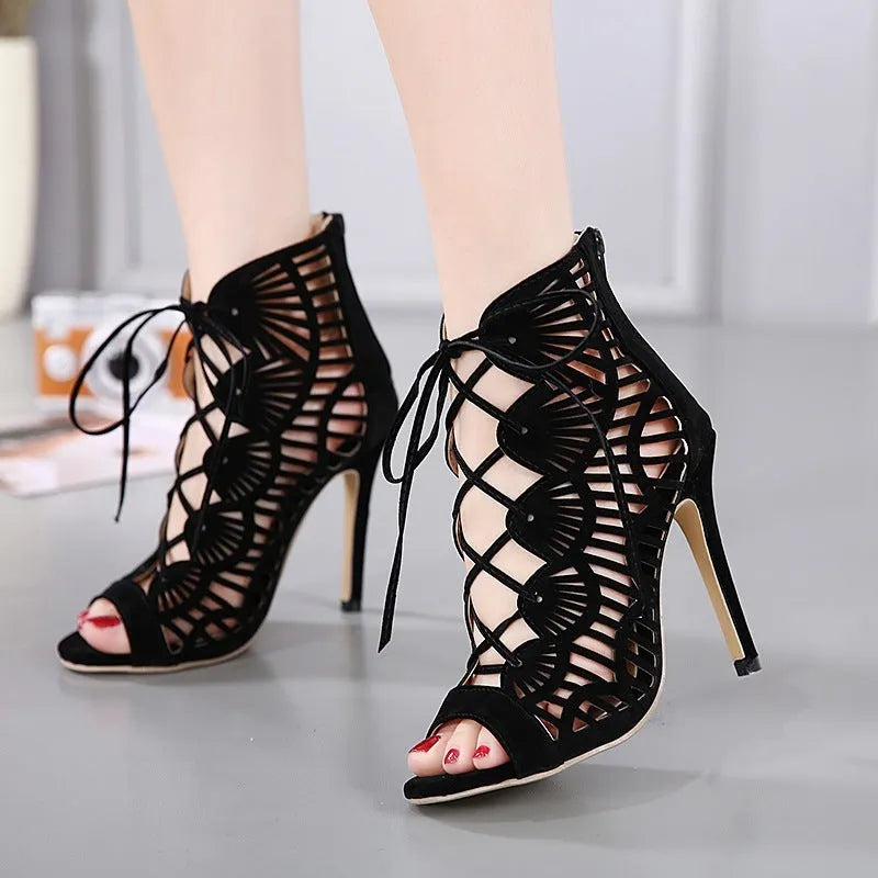 Black suede lace high heels with fish mouth toe, stiletto heel above 8 cm, and hollow detail.