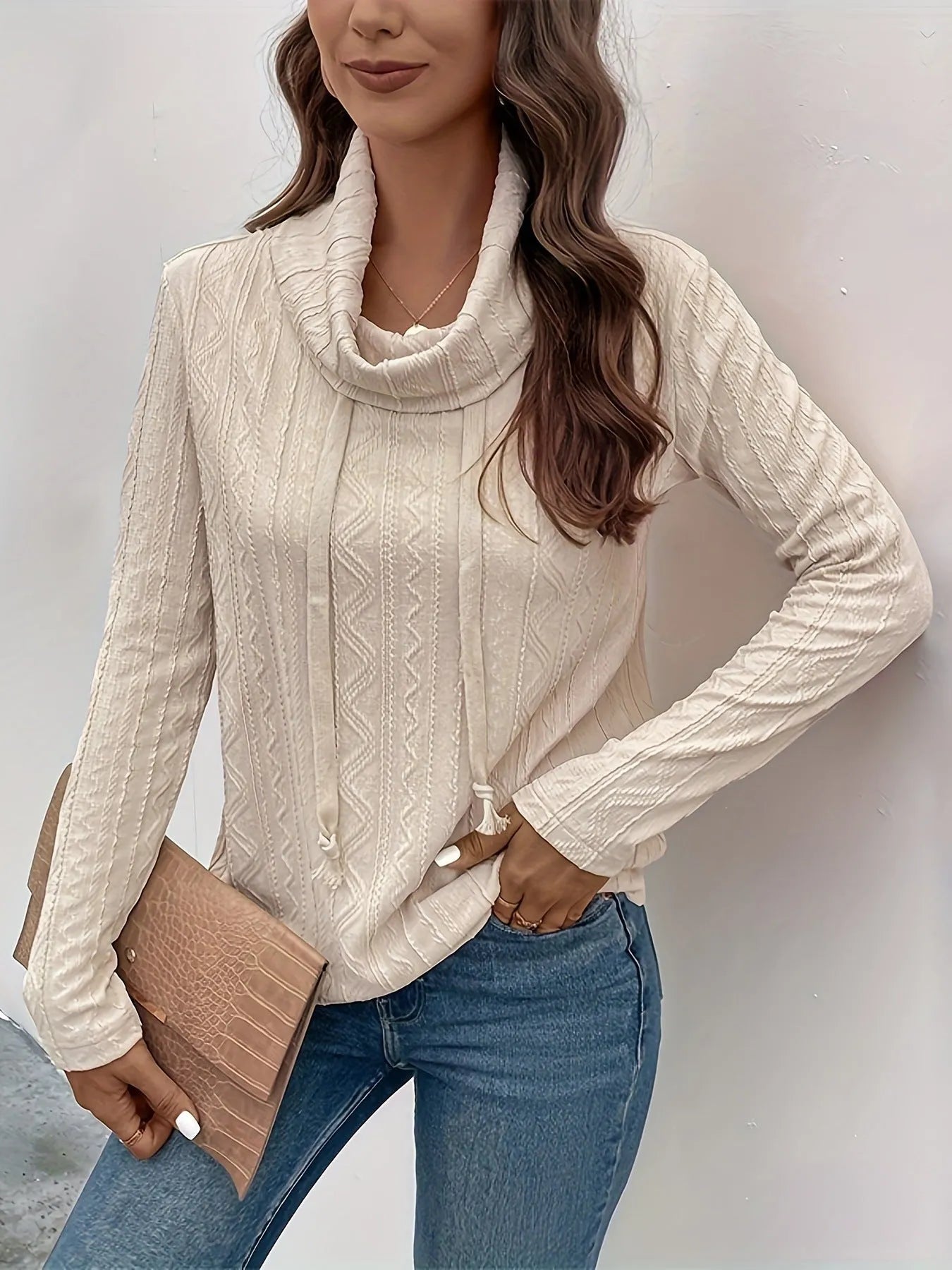 Apricot coloured long sleeve hooded pullover sweater with drawstring adjustment