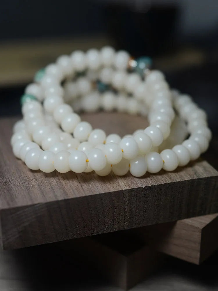 White Jade Bodhi Root bracelet with 108 flat round beads, shown in two size options.