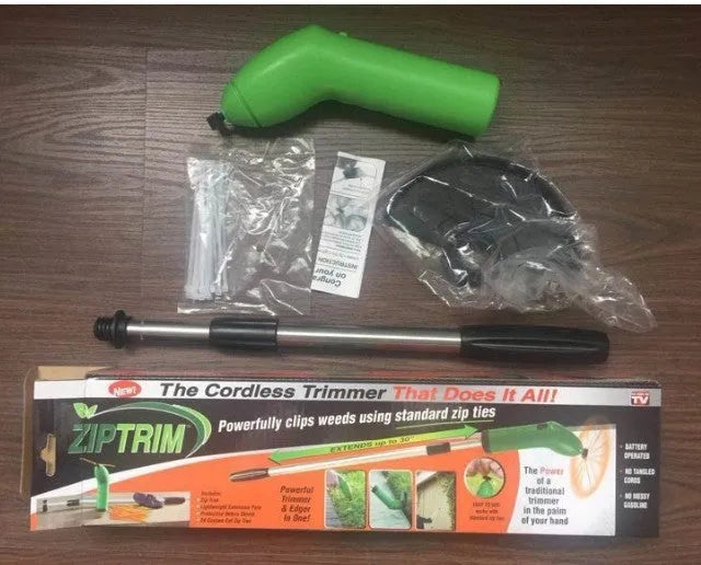 Cordless Zip Trim handheld lawn mower and weed trimmer with extension pole and debris shield.