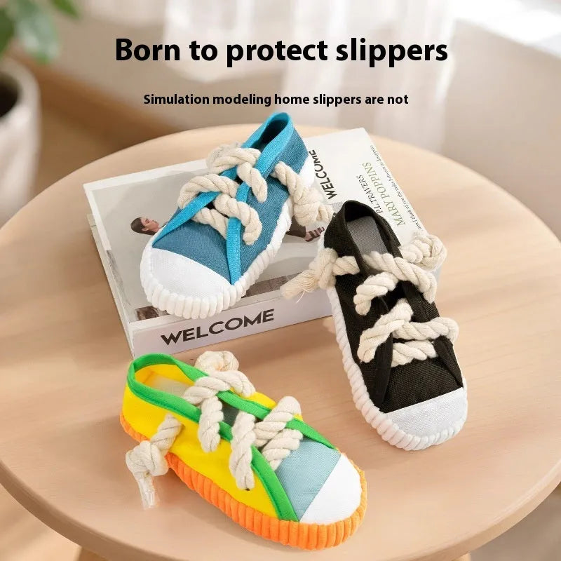 Slipper-shaped plastic dog chew toy with squeaker in three colour options