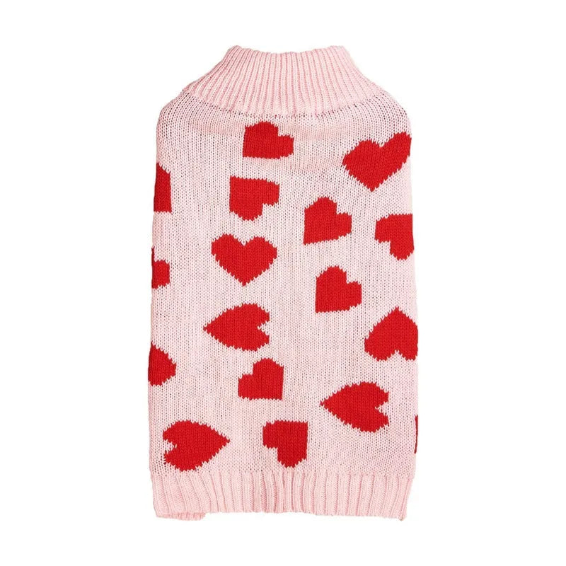 Red dog sweater with a white love heart pattern on the back, sized for a small dog.