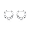 Pair of sterling silver geometric earrings with round elements and electroplated finish