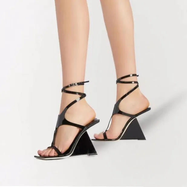 Women's black high heel sandals with square toe and button fastening on a 9.5cm heel.