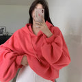 Watermelon red sleeveless Mulberry Silk hooded sweater on a hanger, showing loose fit and solid colour.