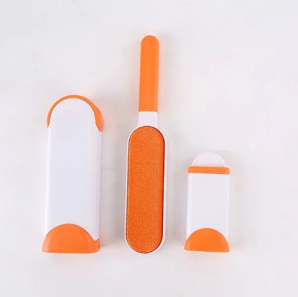 Blue reusable pet hair removal brush with double-sided sticky head placed on its self-cleaning base.