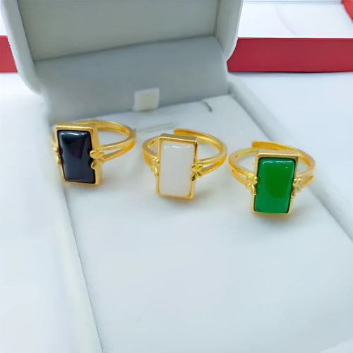 Adjustable brass gold-plated ring with a central electroplated gemstone, shown in black, green, and white colour options.