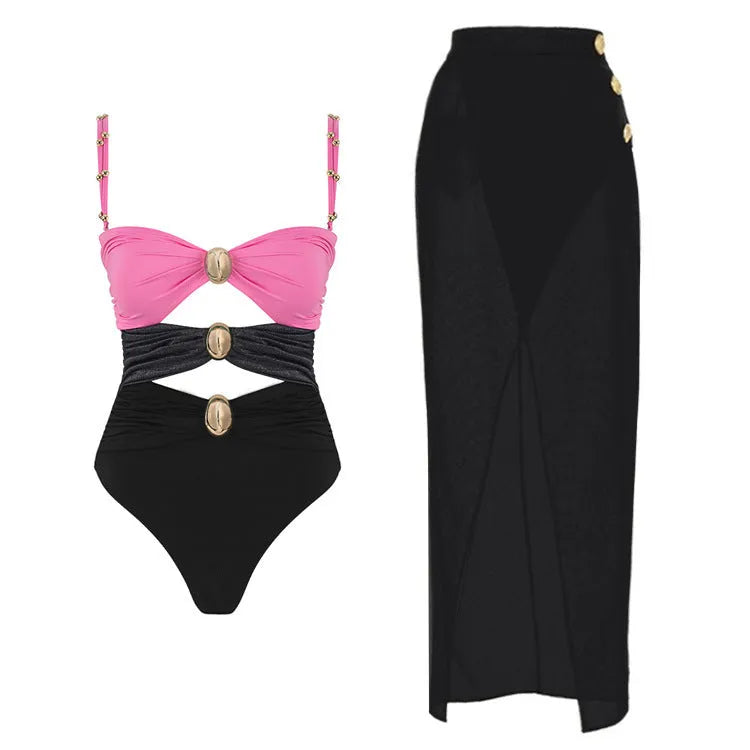 Women's solid colour one-piece swimsuit with gold buttons and a matching detachable skirt.