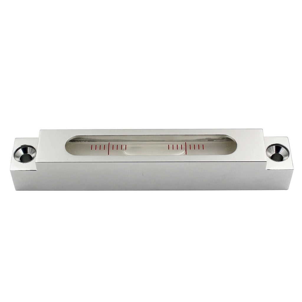 Small metal-bodied spirit level with glass vials, measuring 132mm in length.