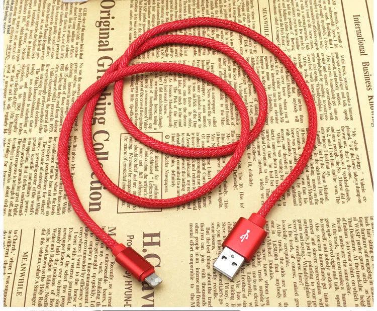 Close-up of a denim-braided USB-C cable with aluminium connectors in choice of colours.