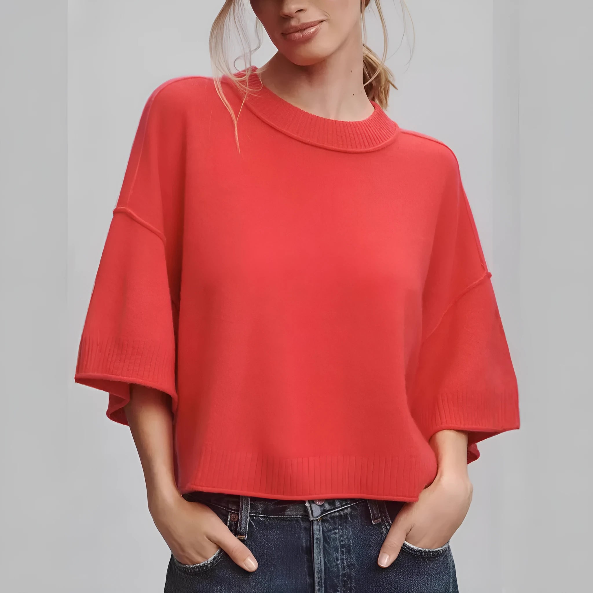 Red short sleeve viscose t-shirt with a cropped, exposed navel hem on a mannequin.