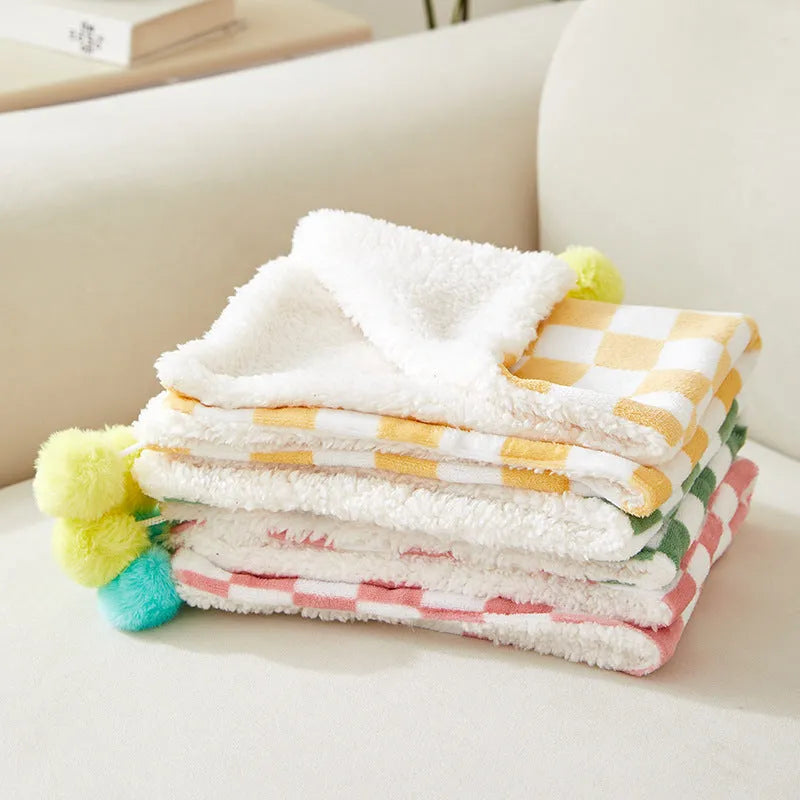 Plaid pattern pet blanket with fur ball decoration in green, pink, or yellow colours
