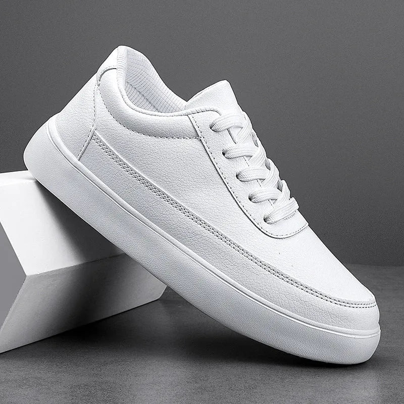 Women's white leather lace-up casual flat shoes on a light background.