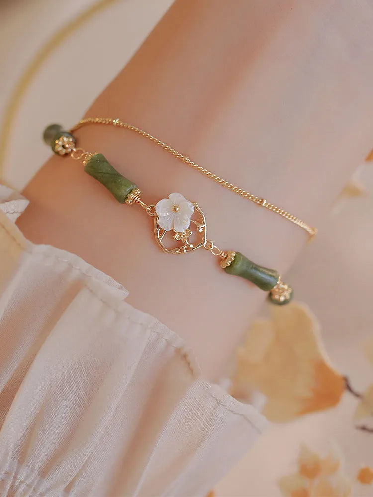 Handmade natural olivine stone bracelet with double layer twin bells of Ireland design.