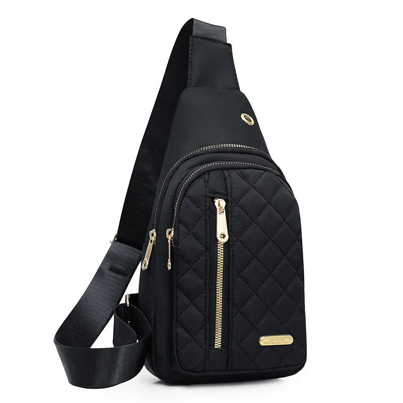 A girl's crossbody sports chest bag in Oxford cloth, shown in a choice of colours including black, dark blue, red, purple, and pink.