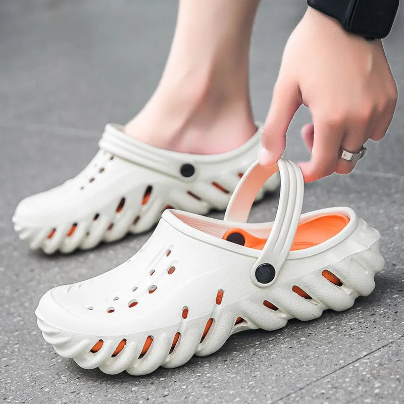 Men's beige EVA slipper sandals with hollow-out design and non-slip sole, shown from the side.