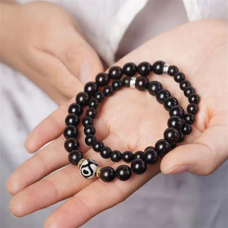 Ebony wood bracelet with 8mm beads and Tibetan two-circle pattern