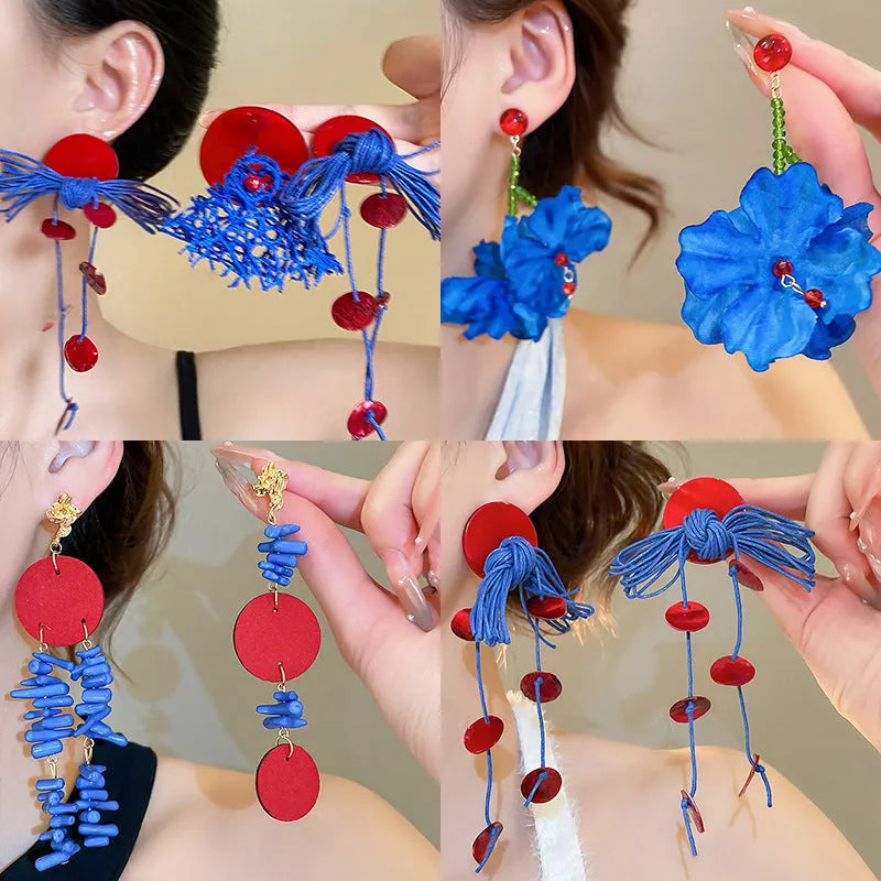 Women's cloth geometry earrings with blue resin flower detail on silver needle, manual craft construction
