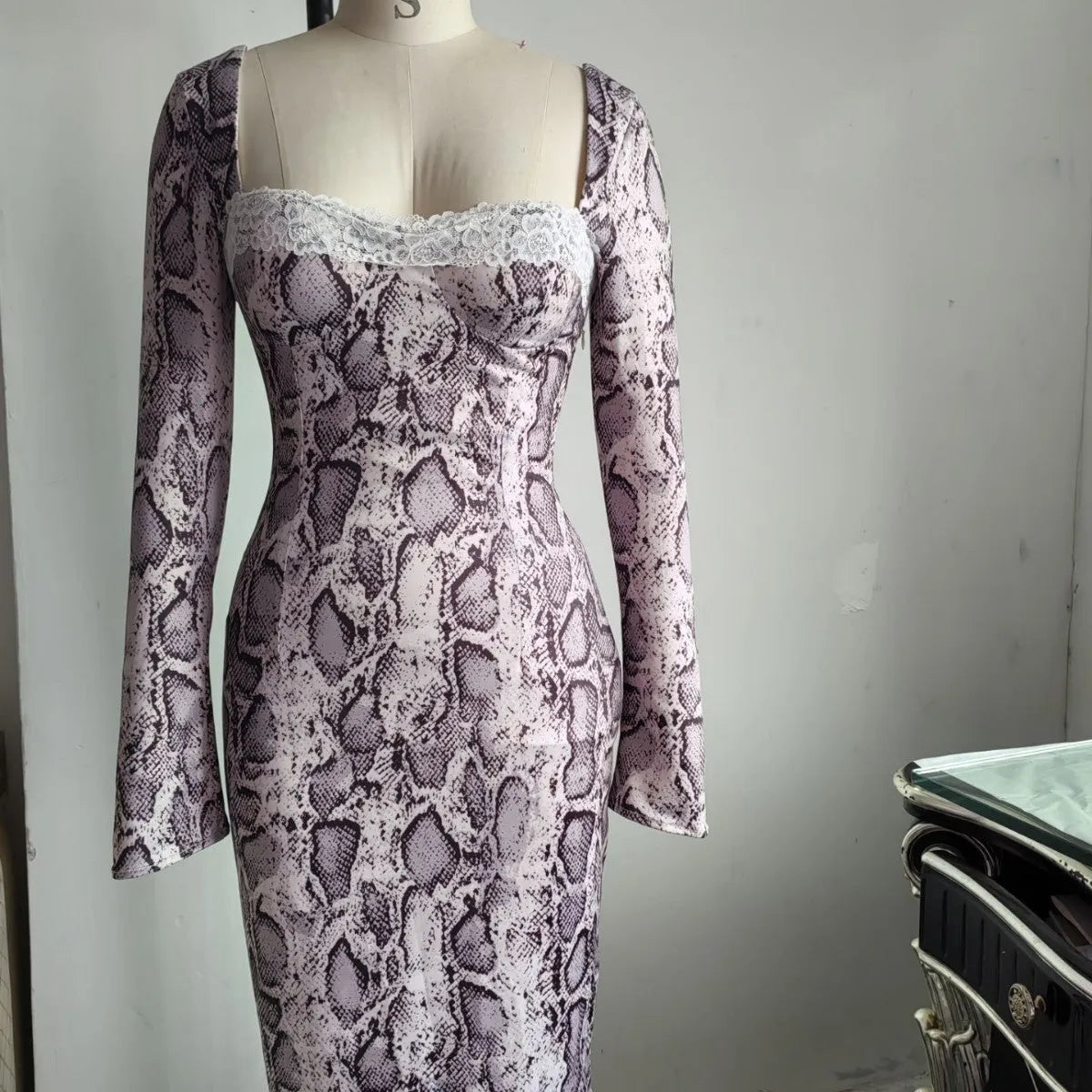 Grey long sleeve digital printed lace dress with 3D pattern and A-line skirt on a mannequin.