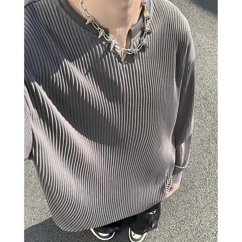 Plus size loose pullover top with striped texture and long sleeves in black colour