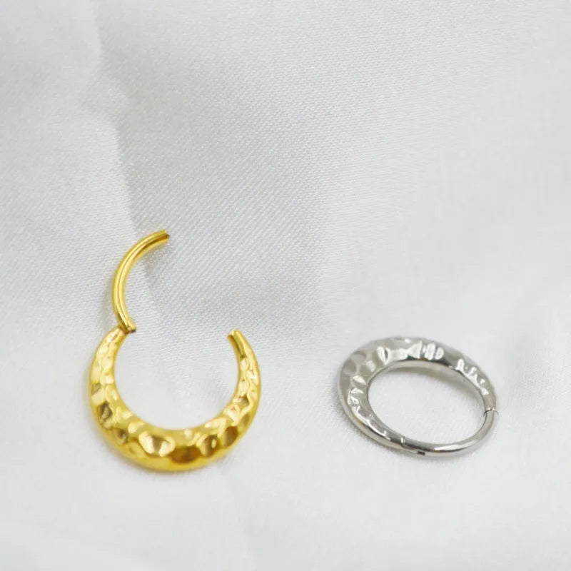 Titanium alloy concave-convex nose ring with carving detail in gold or silver colour.