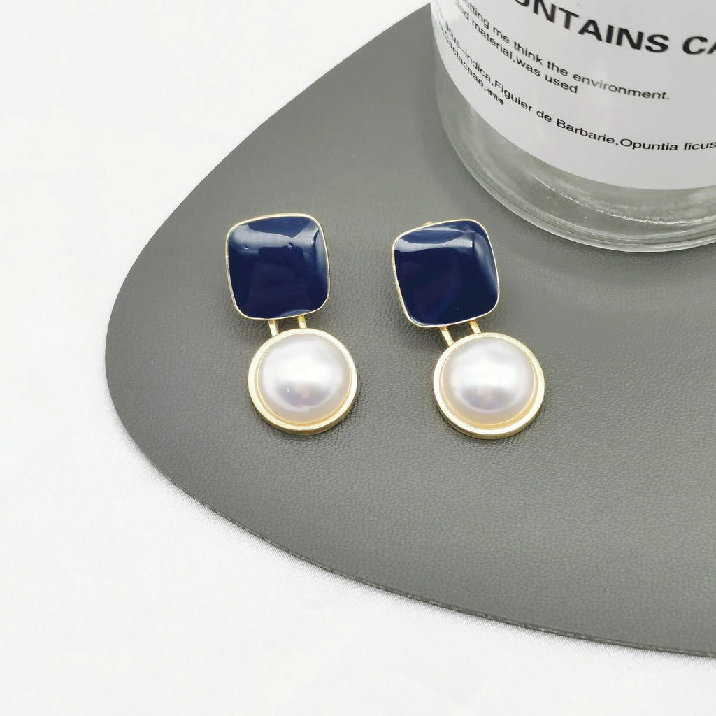 Red and blue geometric alloy stud earrings with pearl detail and quadrilateral shape, one pair