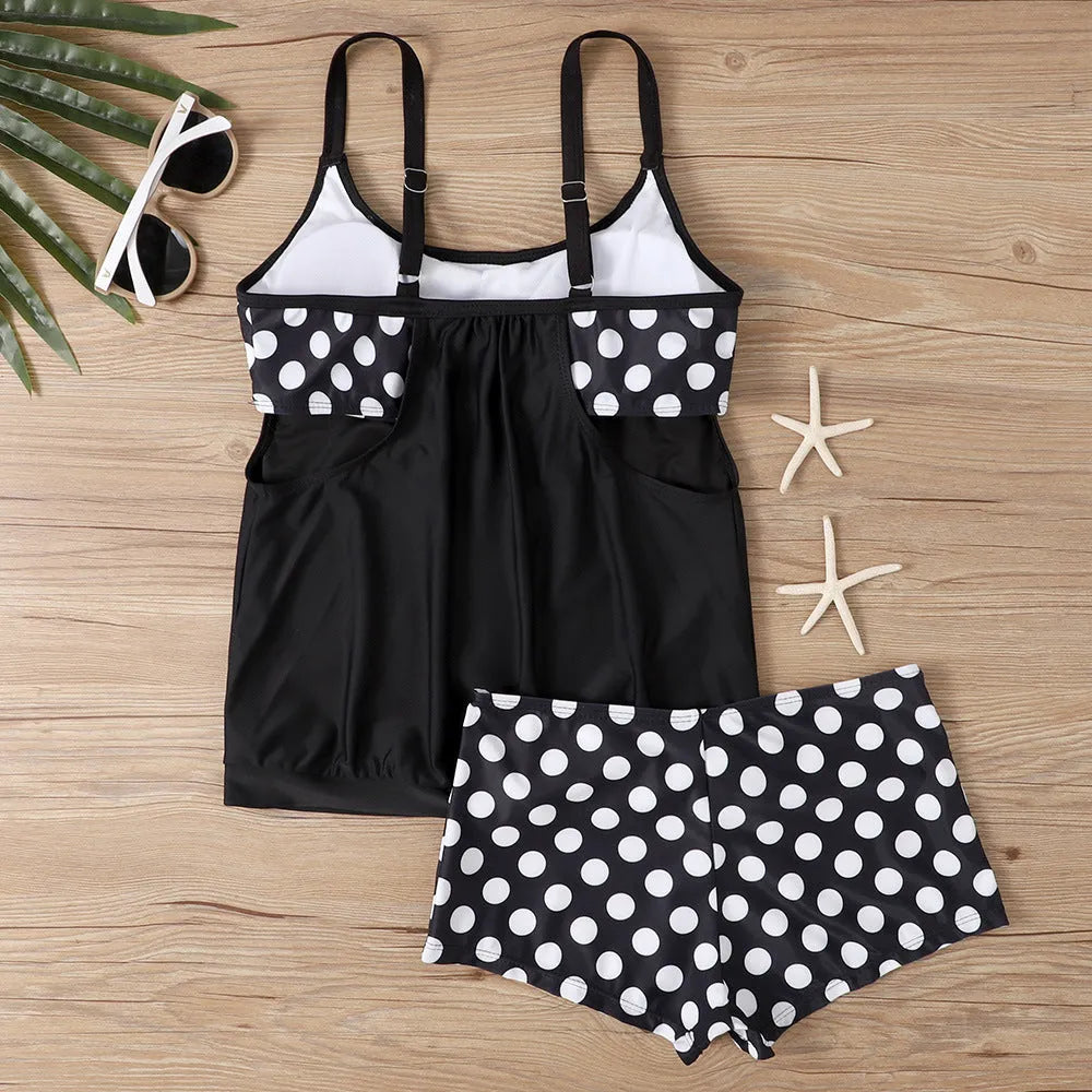 Women's black polka dot bikini set with a high-waisted boxer brief style.