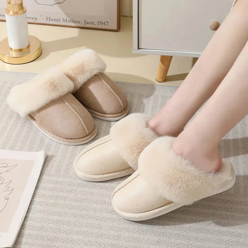 Women's plush winter slippers in pink with a round toe, flat heel, and anti-slip PVC sole.