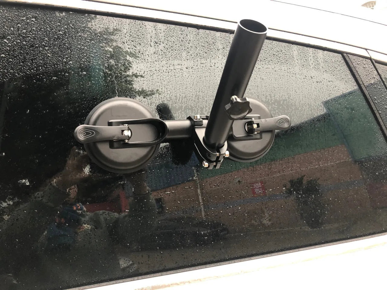 Black off-road car glass sucker mount with round rubber suction cup on ABS plastic base