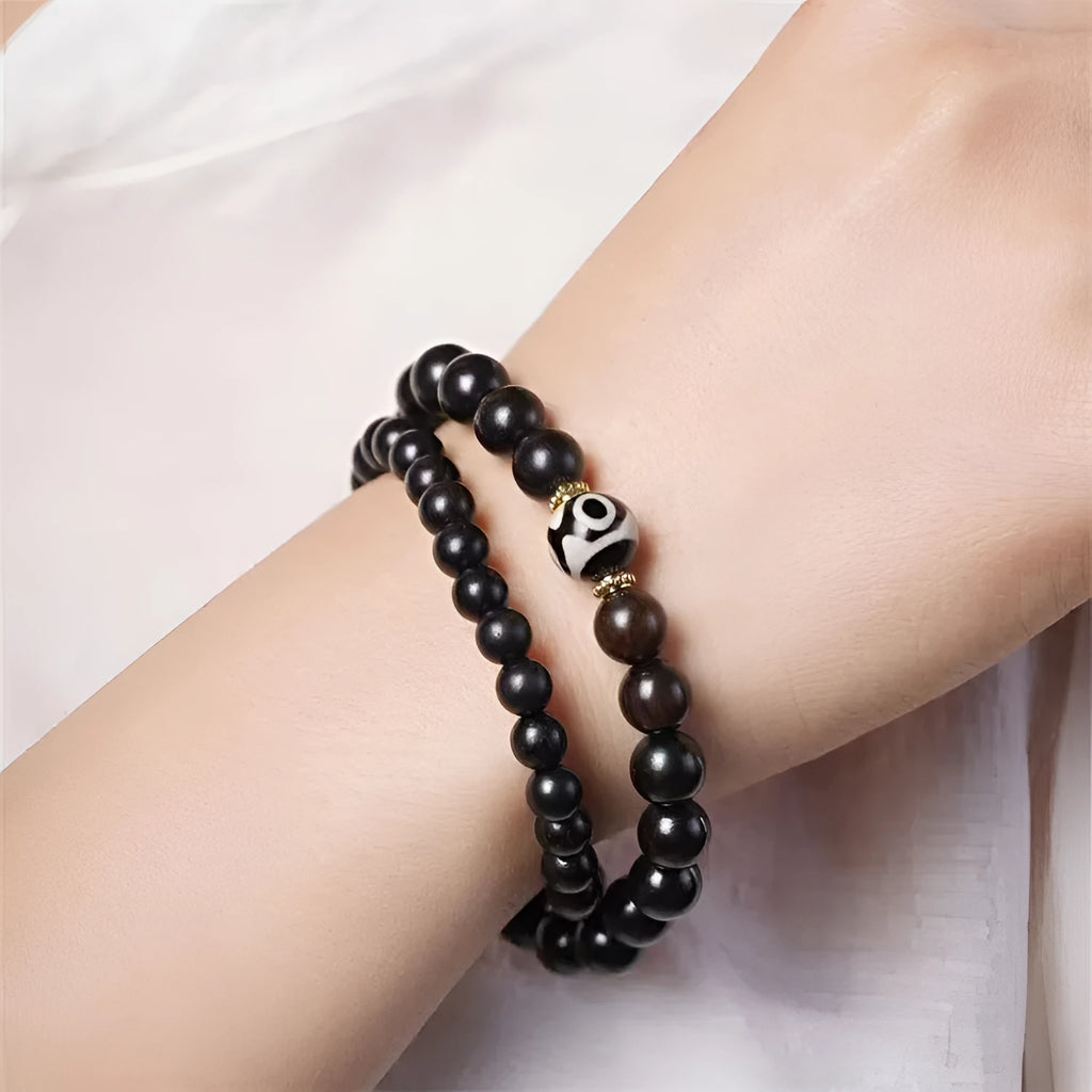 Ebony wood bracelet with 8mm beads and Tibetan two-circle pattern