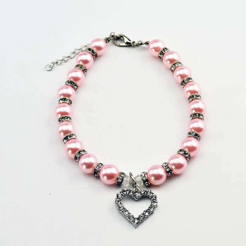 Pet pearl necklace with 10mm imitation pearls, 7mm rhinestone beads, alloy pendant, and white plated K detail