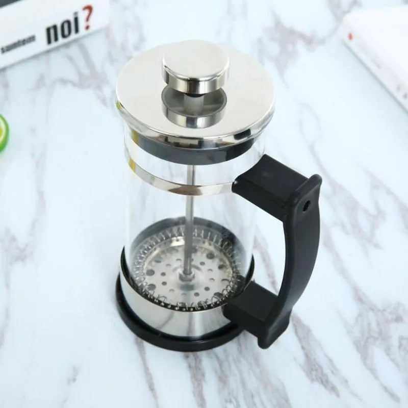 Glass manual coffee maker with stainless steel filter, 350ml capacity, dimensions 10cm by 8cm by 17cm.