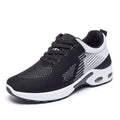 Women's pink Flyknit casual running shoes with mesh lining and flat PVC sole on a white background.