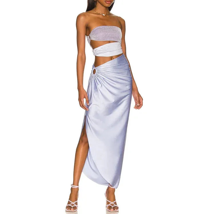 Purple hollow polyester swimsuit and matching wrap skirt set on mannequin