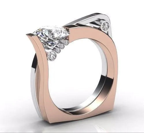 Rose gold geometric couple ring with inlaid zircon stone, shown in women's size.