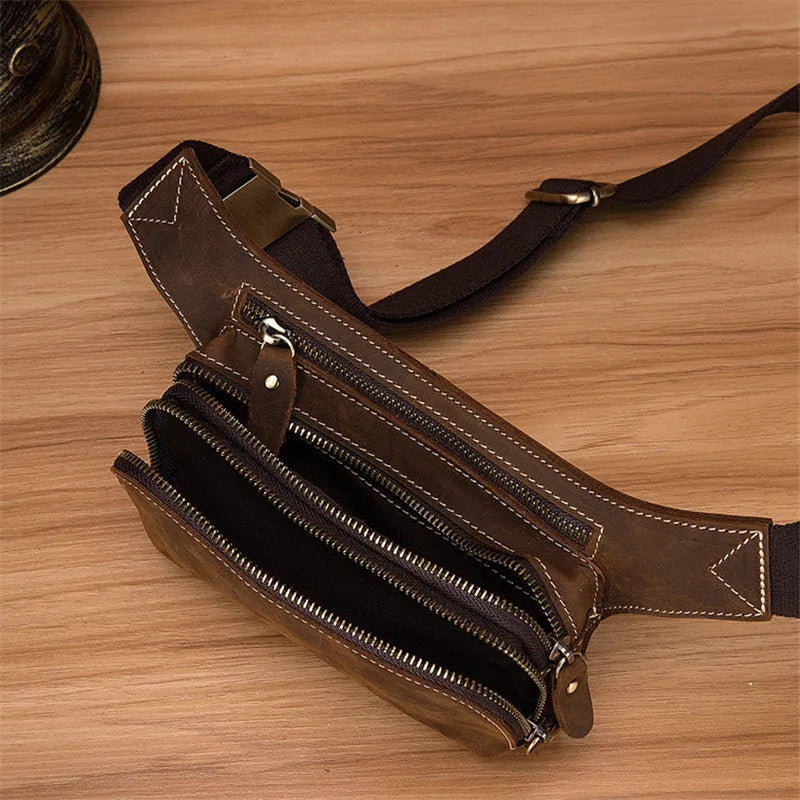 Brown top layer cow leather men's sports waist bag with zip closure.