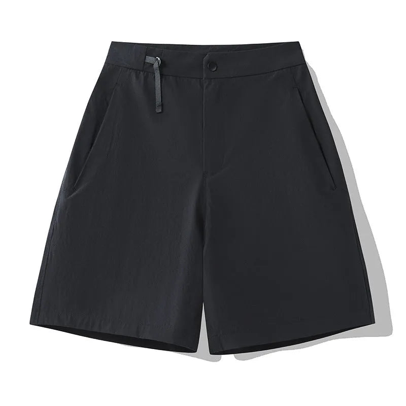 Men's solid colour quick-drying sports shorts with elastic waist, shown in army green.