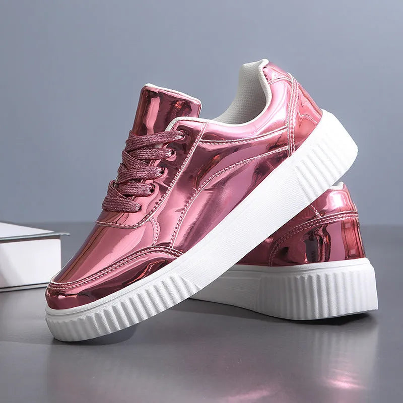 Rose gold sequin platform sneaker with thick sole and round toe on a white background.
