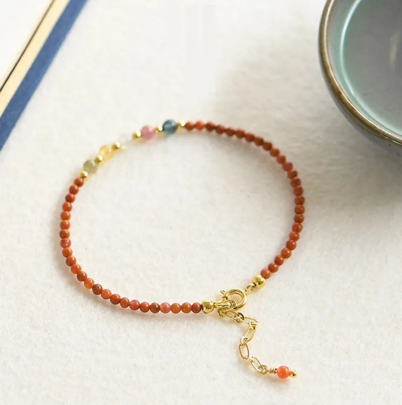 Natural freshwater pearl and geometric crystal bead bracelet with elasticated rope