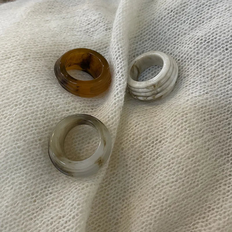 Geometric resin wide ring with irregular shape in retro Chinese style showing earthy colour options